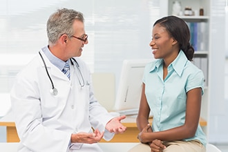 Doctor talking with a patient.