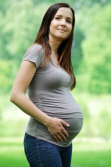pregnant woman in jeans and t-shirt