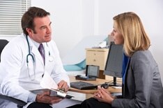 A doctor speaking with a patient.