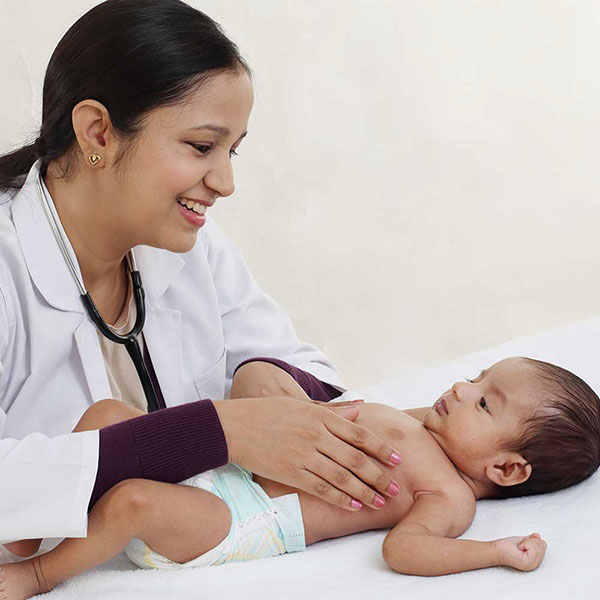 female doctor examining baby