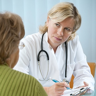 Doctor listens to her patient