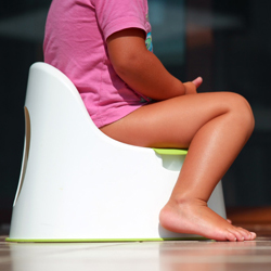 Child sitting on a toilet