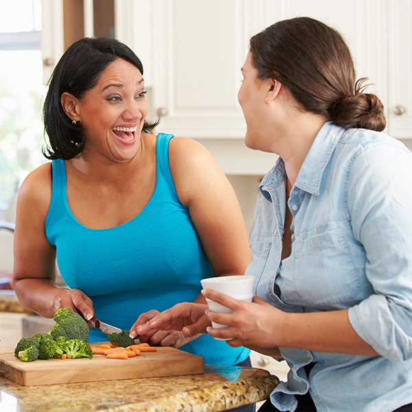 NAFLD: Two women in a kitchen preparing food together