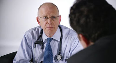 Photo of a doctor talking with a patient