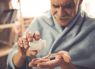A woman takes her medicine.
