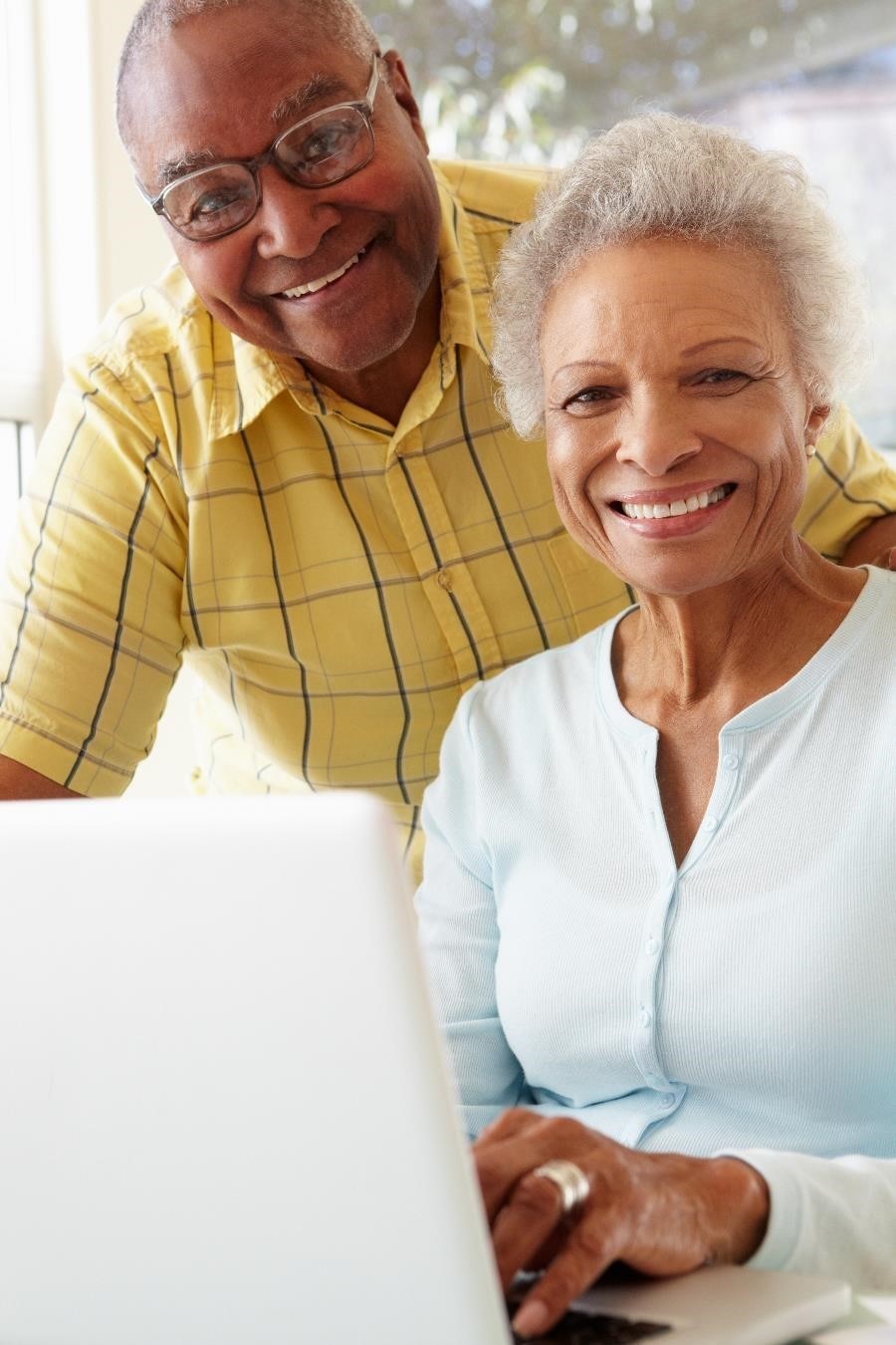 Smiling older couple.