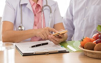 A dietitian provides instructions to a patient.