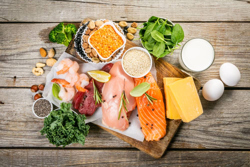 A variety of animal- and plant-based proteins on a cutting board.