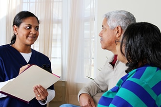 Couple talking to a healthcare provider.