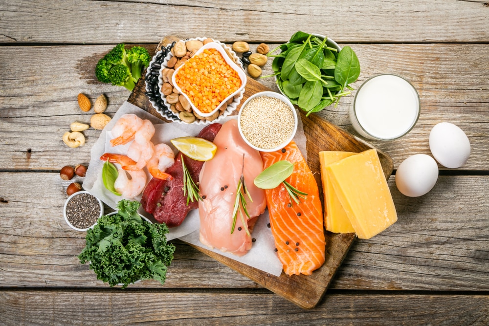 A variety of animal- and plant-based proteins on a cutting board.