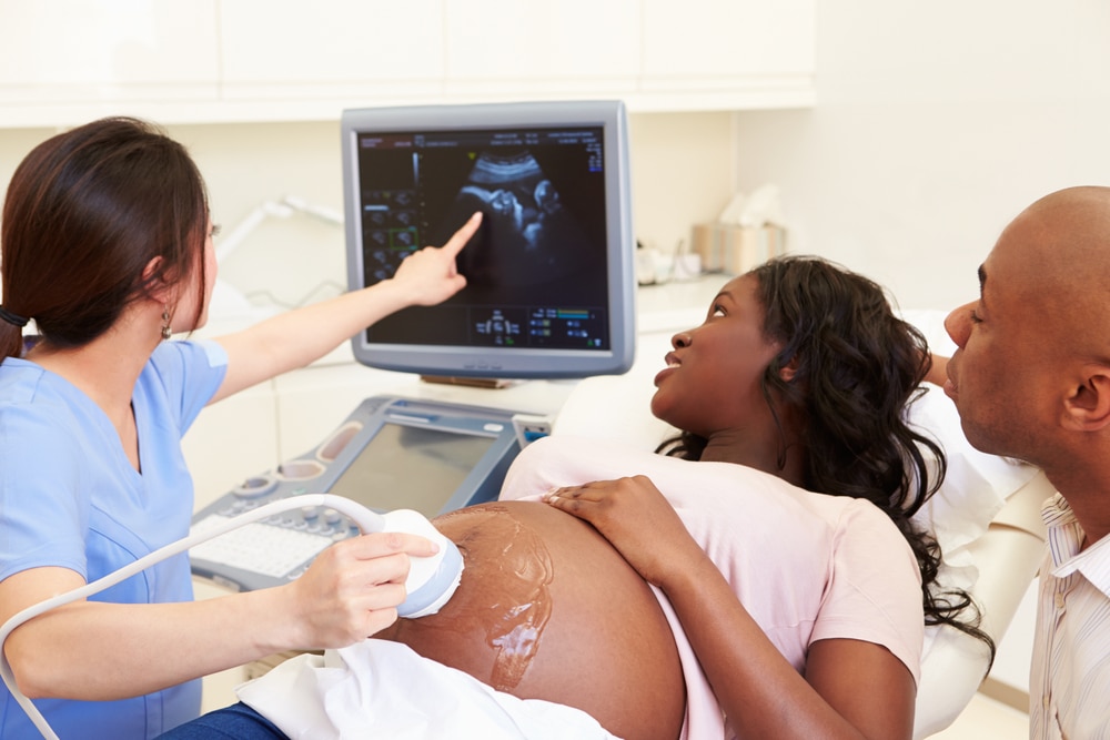 A pregnant woman undergoing a prenatal ultrasound.