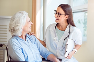 A medical professional checks on a patient.