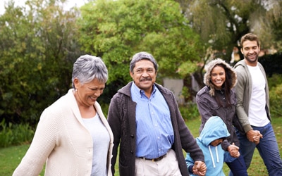 Family walking through a park.