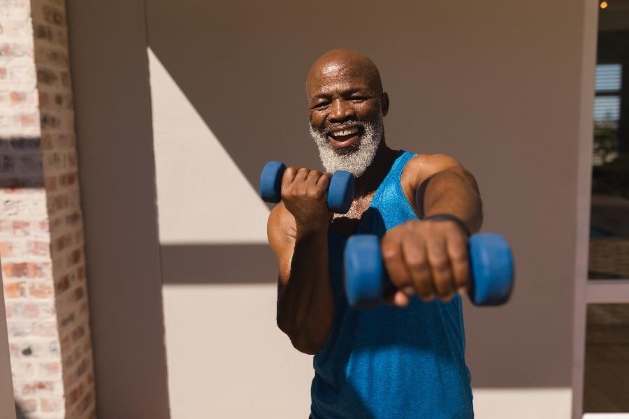 Man using dumbbells to work out.