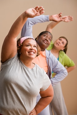 Women stretching in a fitness class.