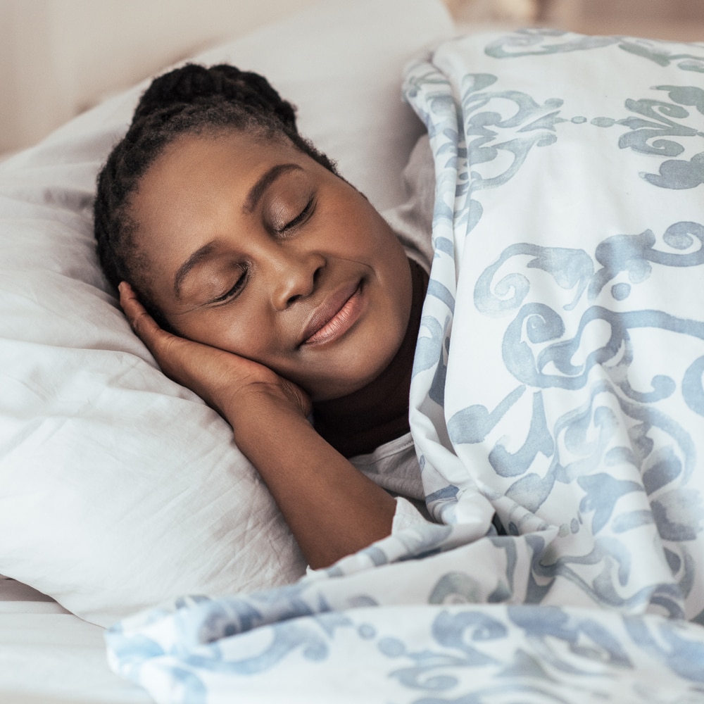 Woman sleeping in her bed.