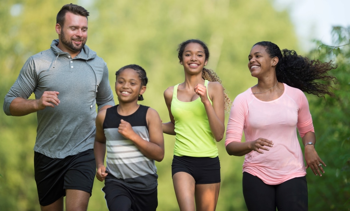 A young family of four doing relaxation exercise