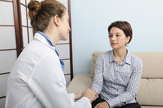 Woman patient with doctor.