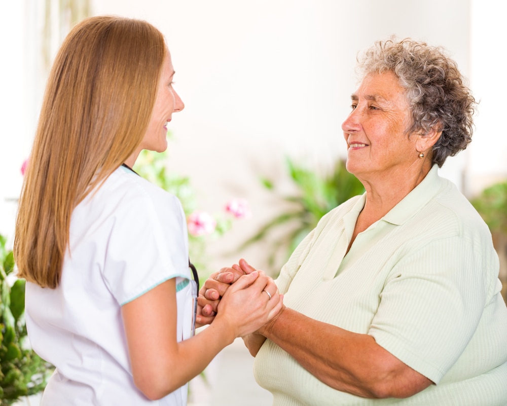 Health care professional talking with a patient.