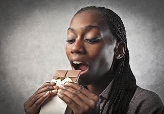 Woman eating chocolate