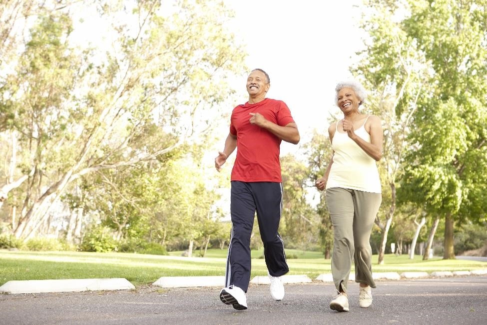 A couple running outdoors