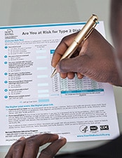Man completing an assessment form