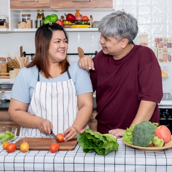 Couple cooking in the kitchen.