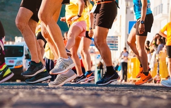 The feet of a crowd of runners