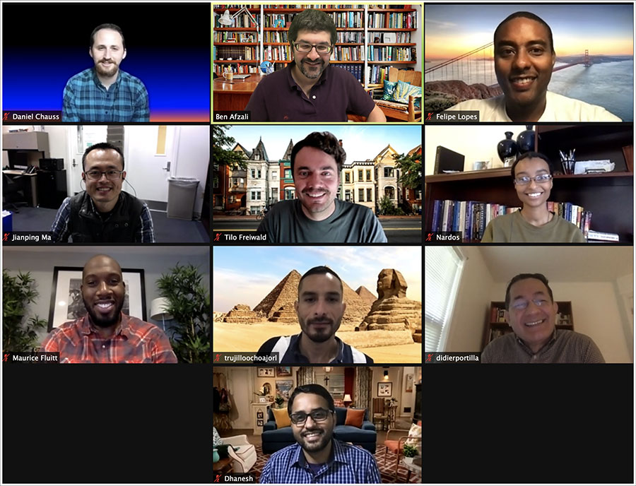 Screenshot of a Zoom call between lab members who are smiling.