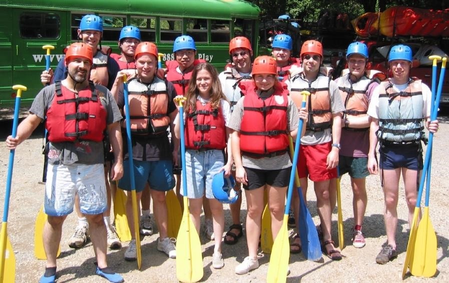 Group photo of the bax group wearing rafting gear