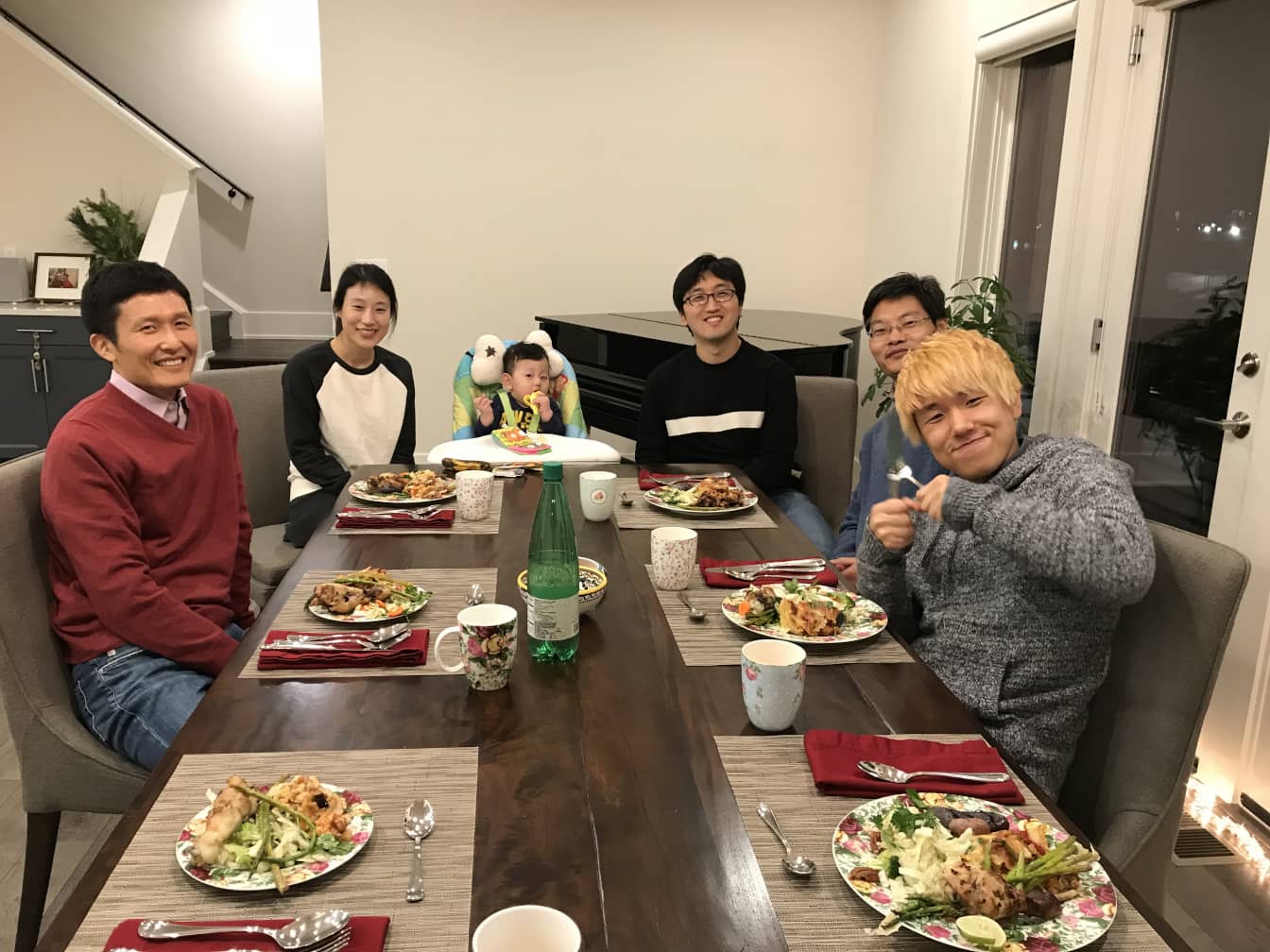 Members of the lab eat lunch around a table.