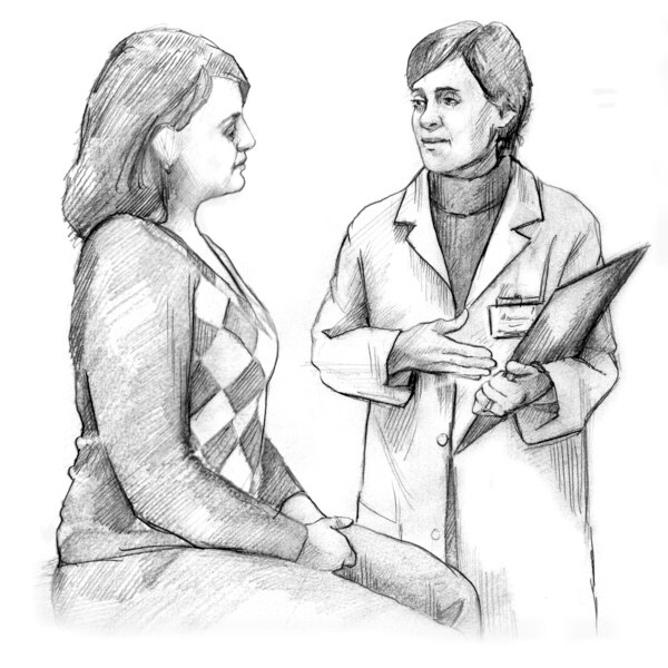 A female doctor talking with a female patient. 