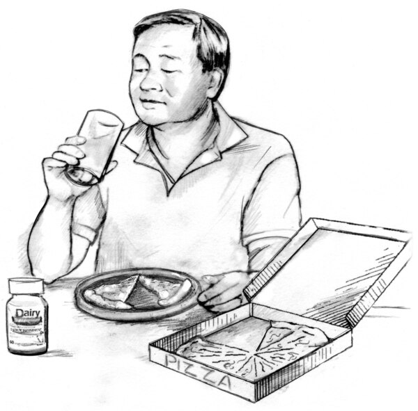 A man sitting at a table, lifting a glass to his mouth. An open pizza box, a plate with two pizza slices, and a bottle of lactase tablets are on the table.