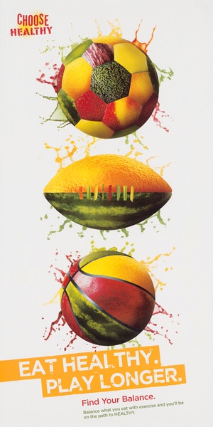 Image of a soccer ball, football, and basketball all made out of fruits and vegetables